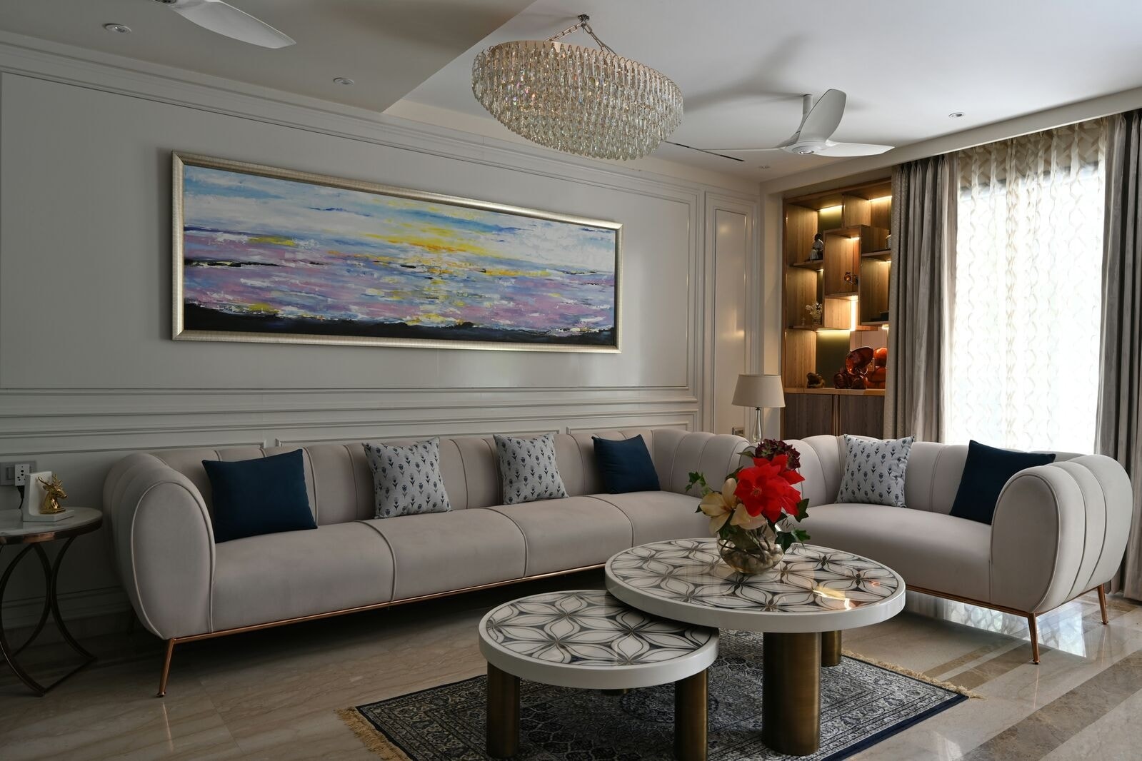 Elegant apartment interior with marble flooring, contemporary furniture, and artistic wall decor